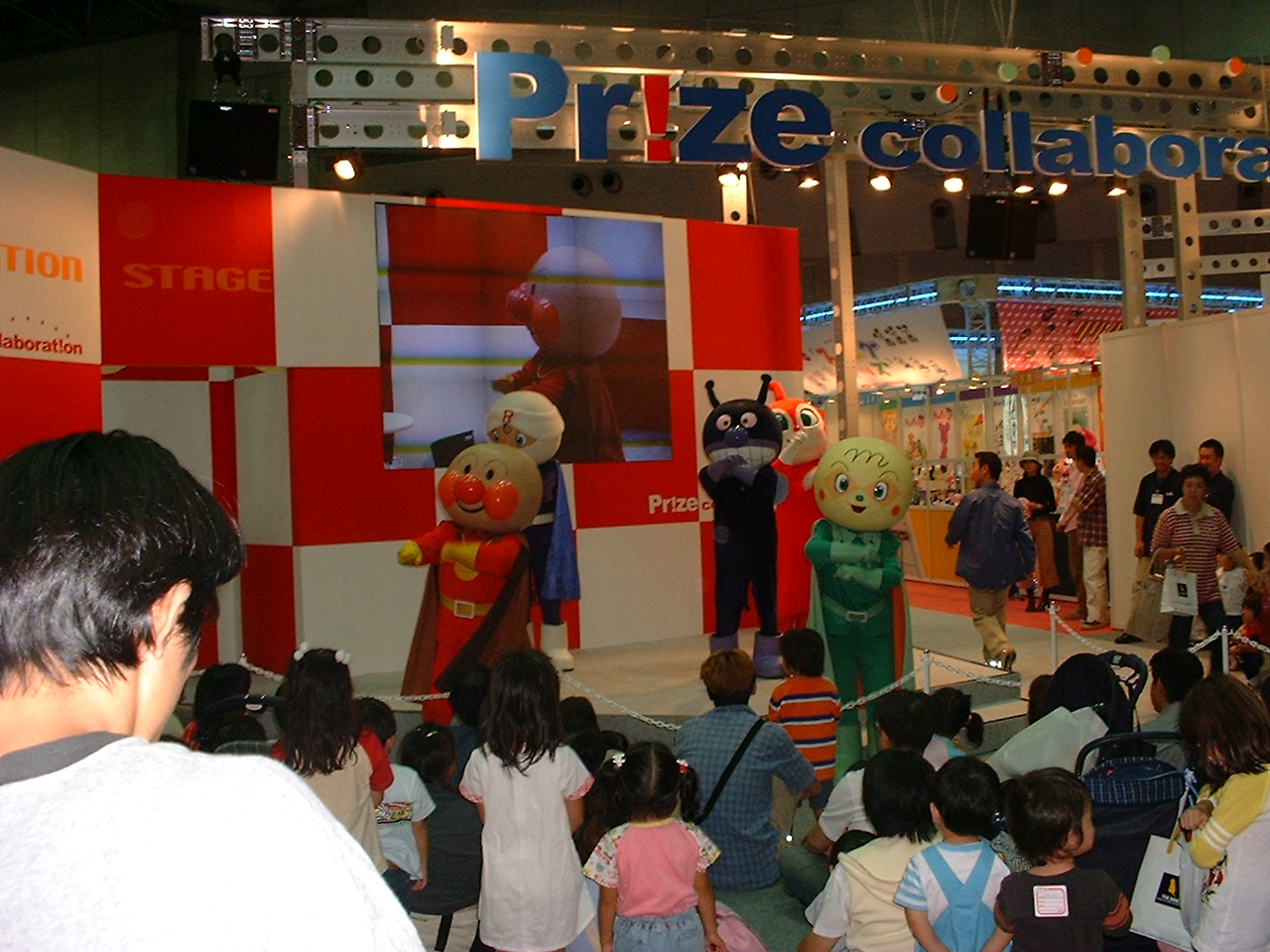 people dressed as tv characters perform for children