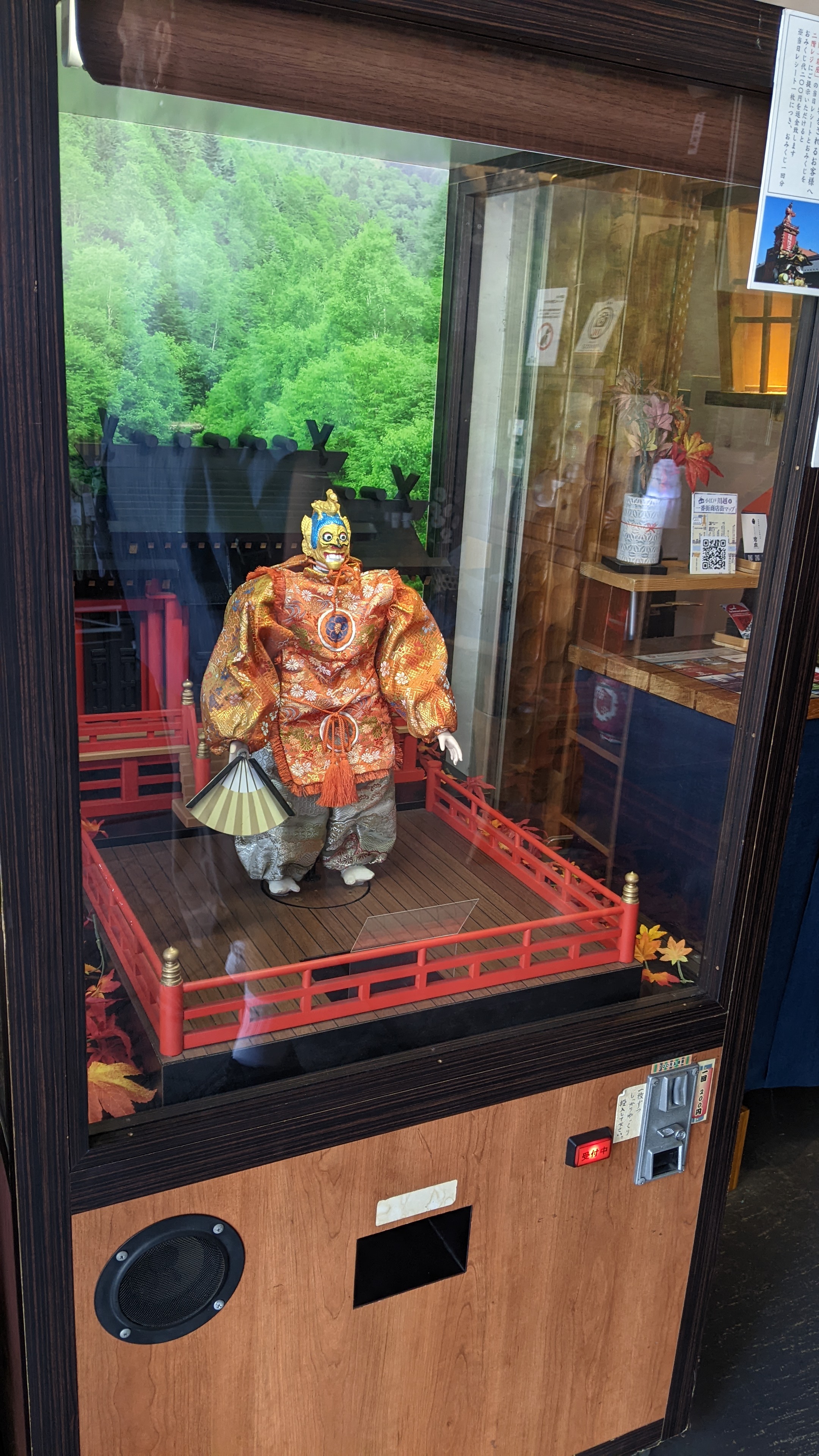 coin operated automaton wearing a traditional outfit