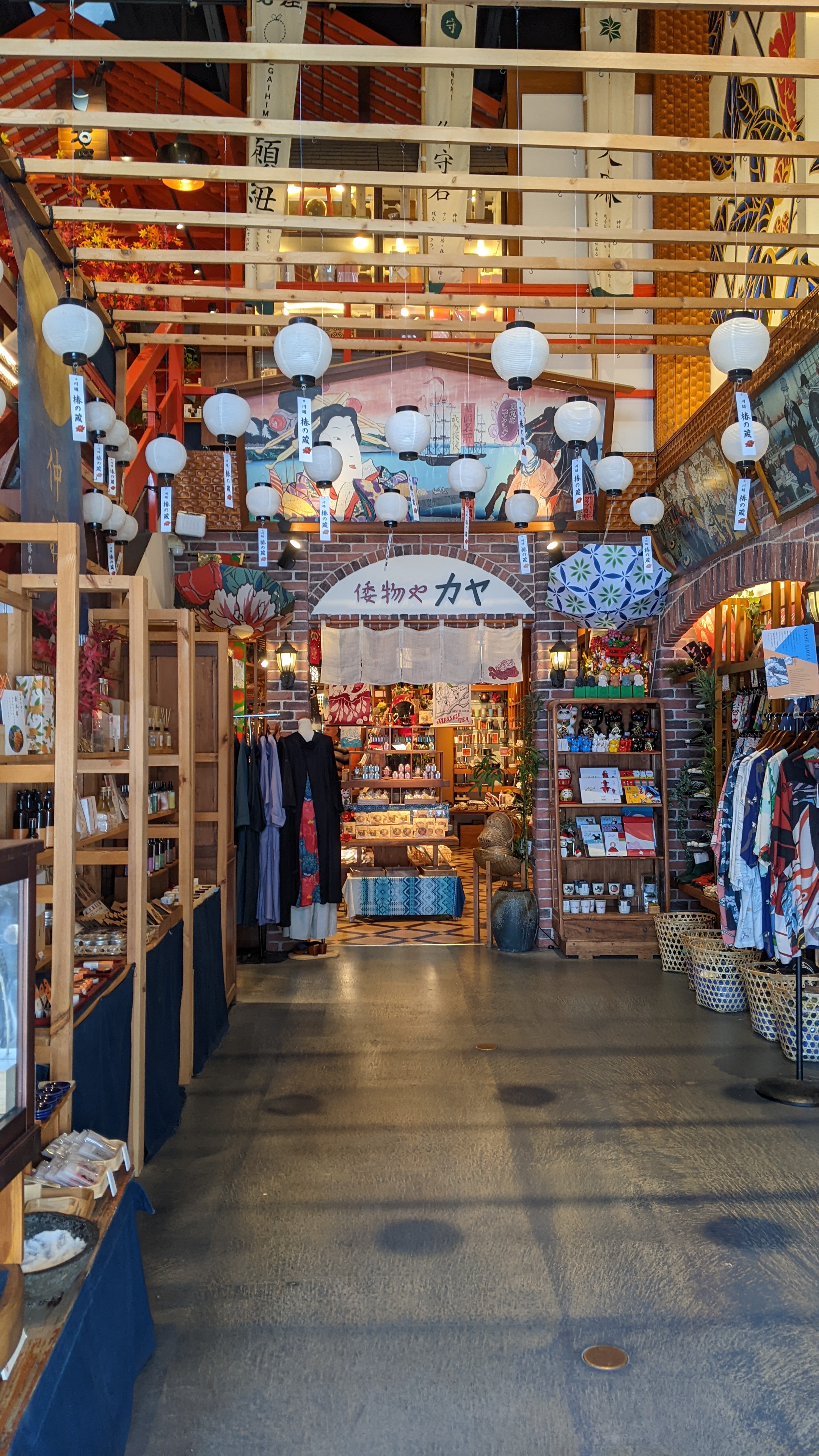 store interior with lanterns and a high ceiling with thin wooden beams