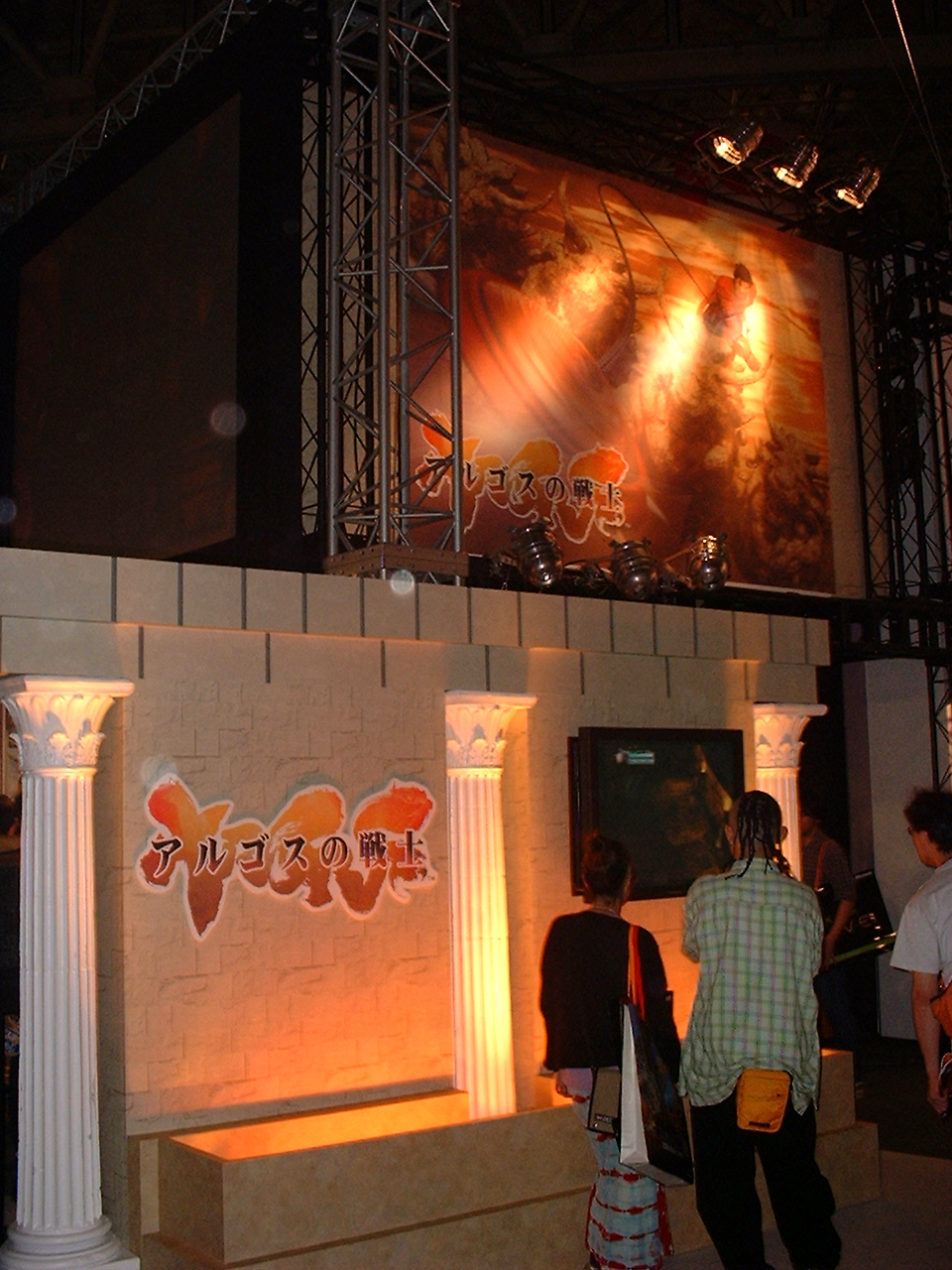 a display with greek columns and a japanese logo