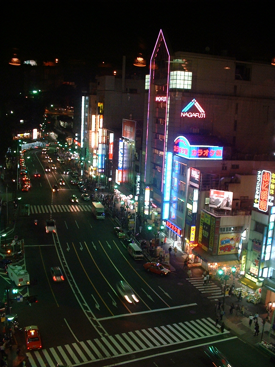 the other side of the same street with more illuminated buildings