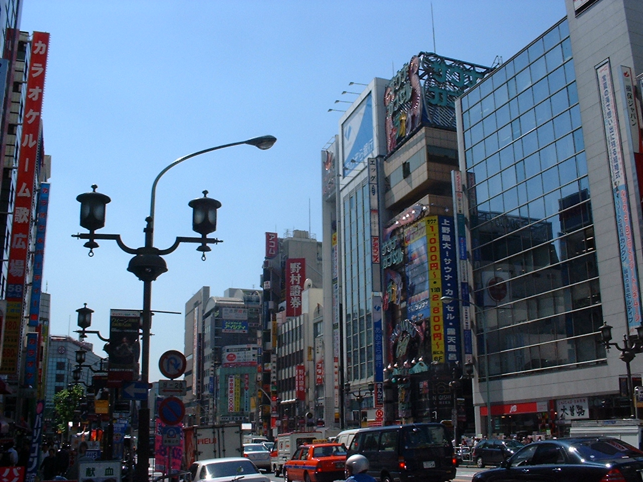 glass windowed buildings on a busy street