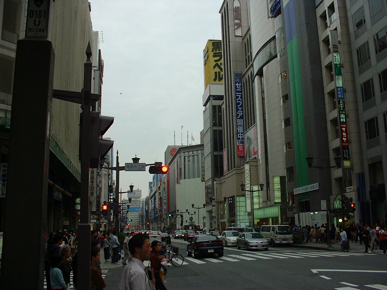 many tall thin buildings line a busy street
