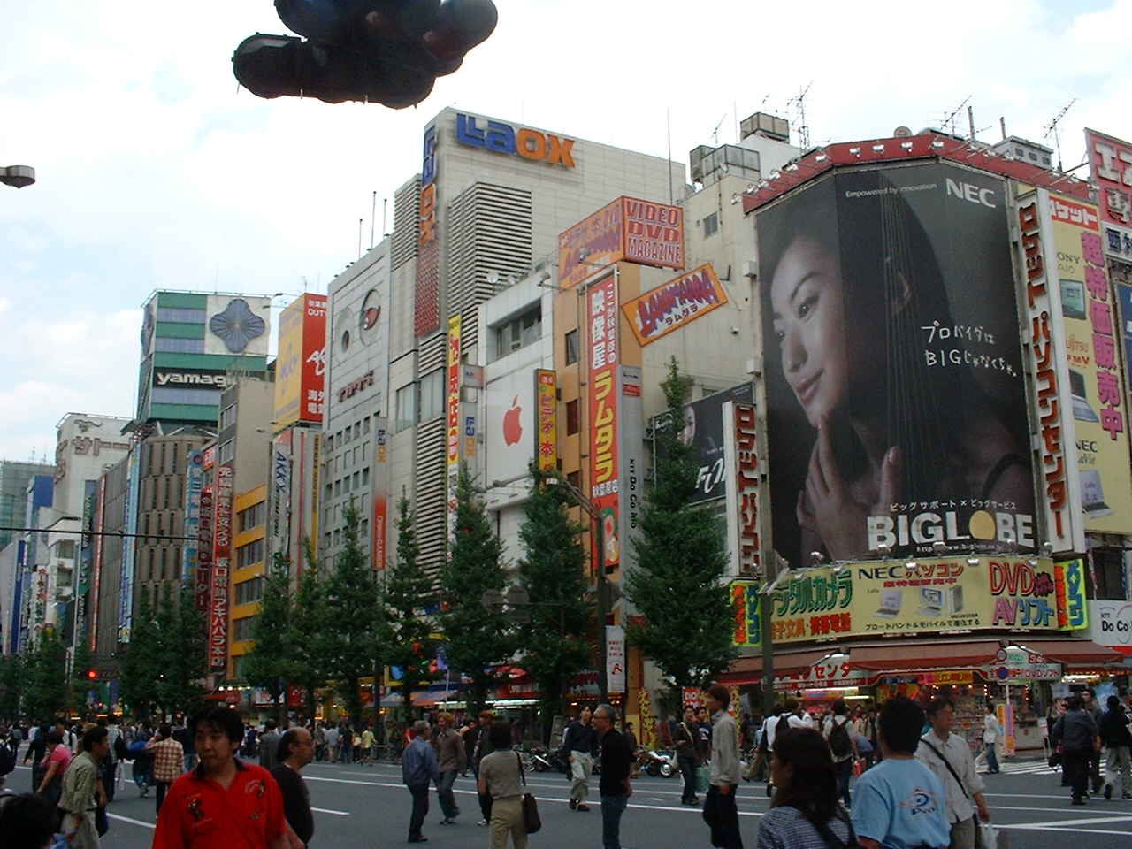 tall buildings with japanese text on them as well as some english