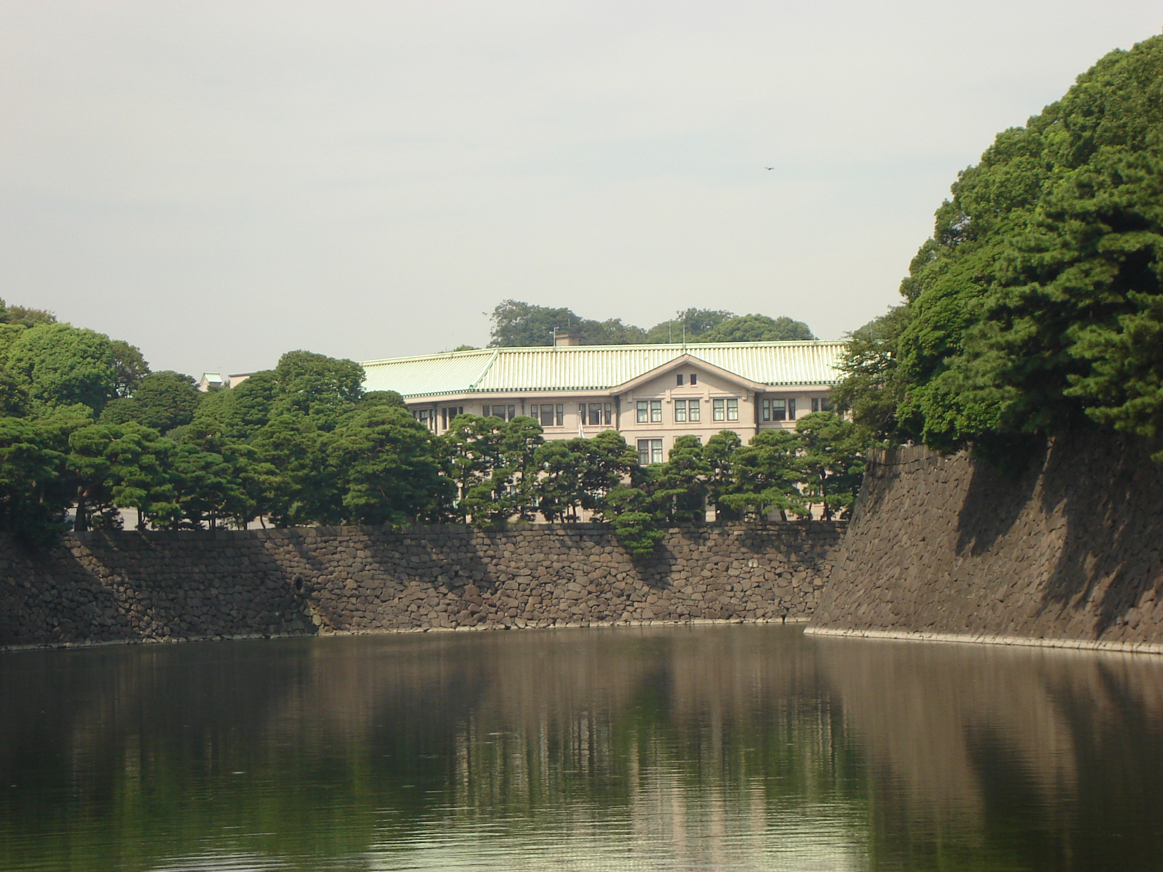 a view of the pale palace building across the moat