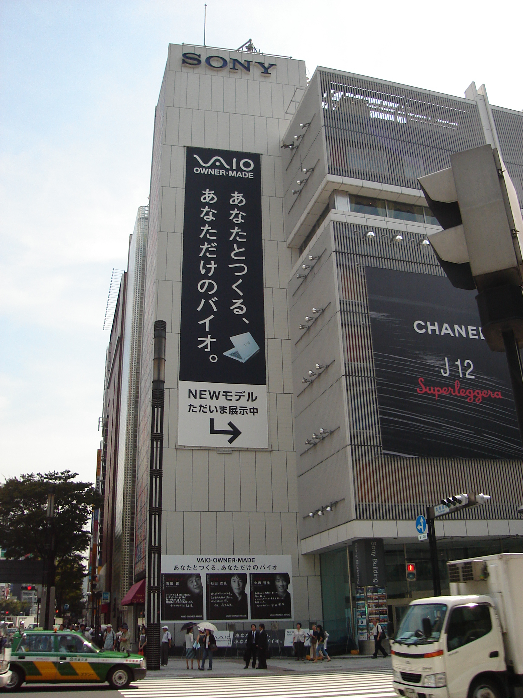 a tall grey building with the sony logo on top