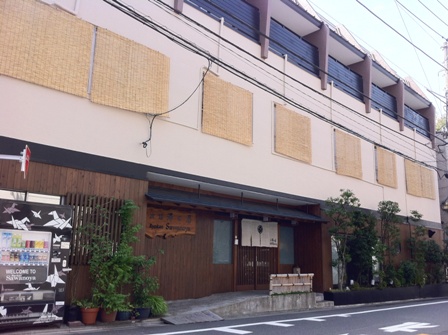 three story japanese bulding with traditional style entryway