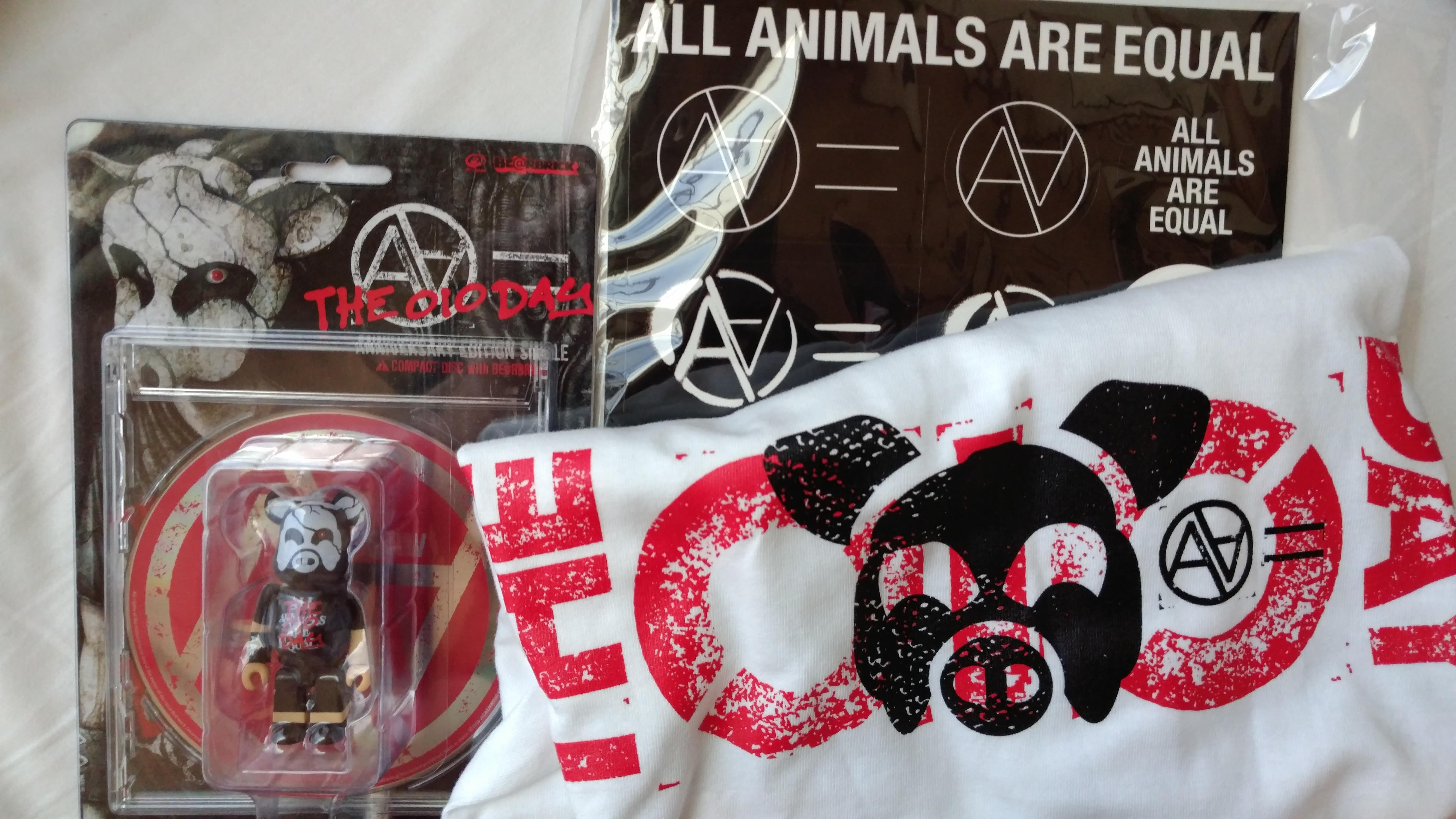 shirt, stickers, and cd with a toy figure
