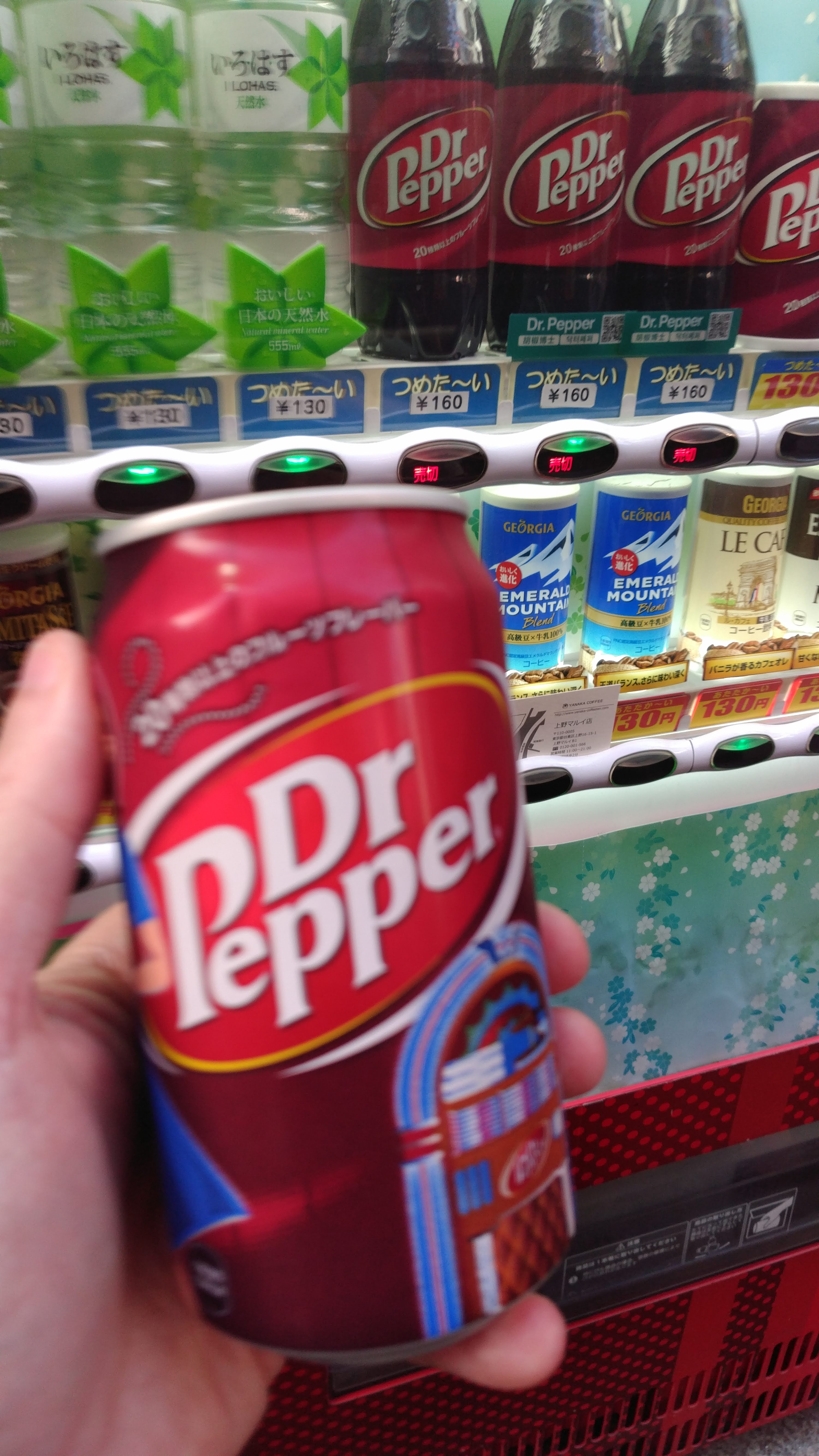 Dr. Pepper can in front of vending machine