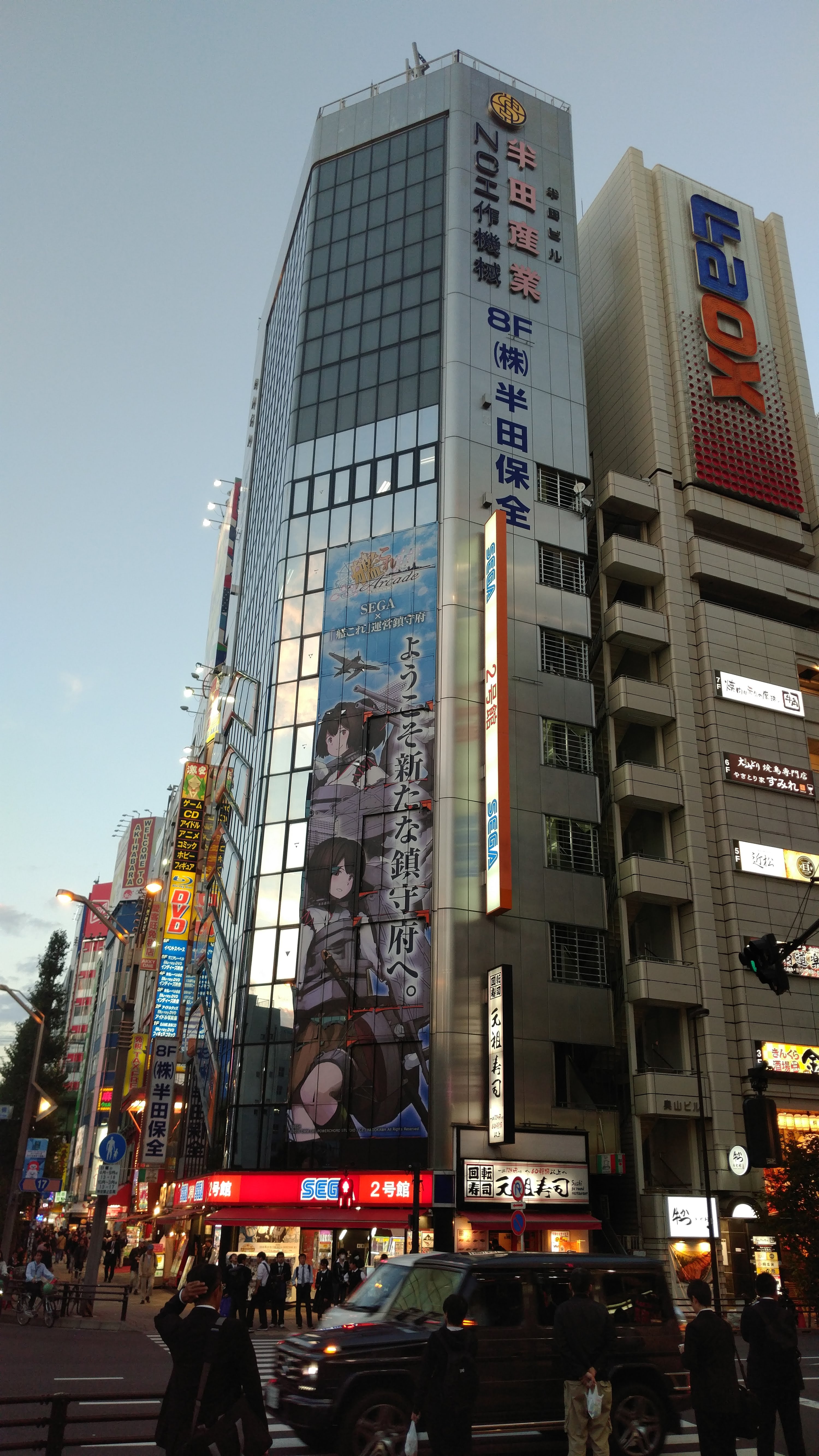 a tallbuilding with a large illustrated advertisement