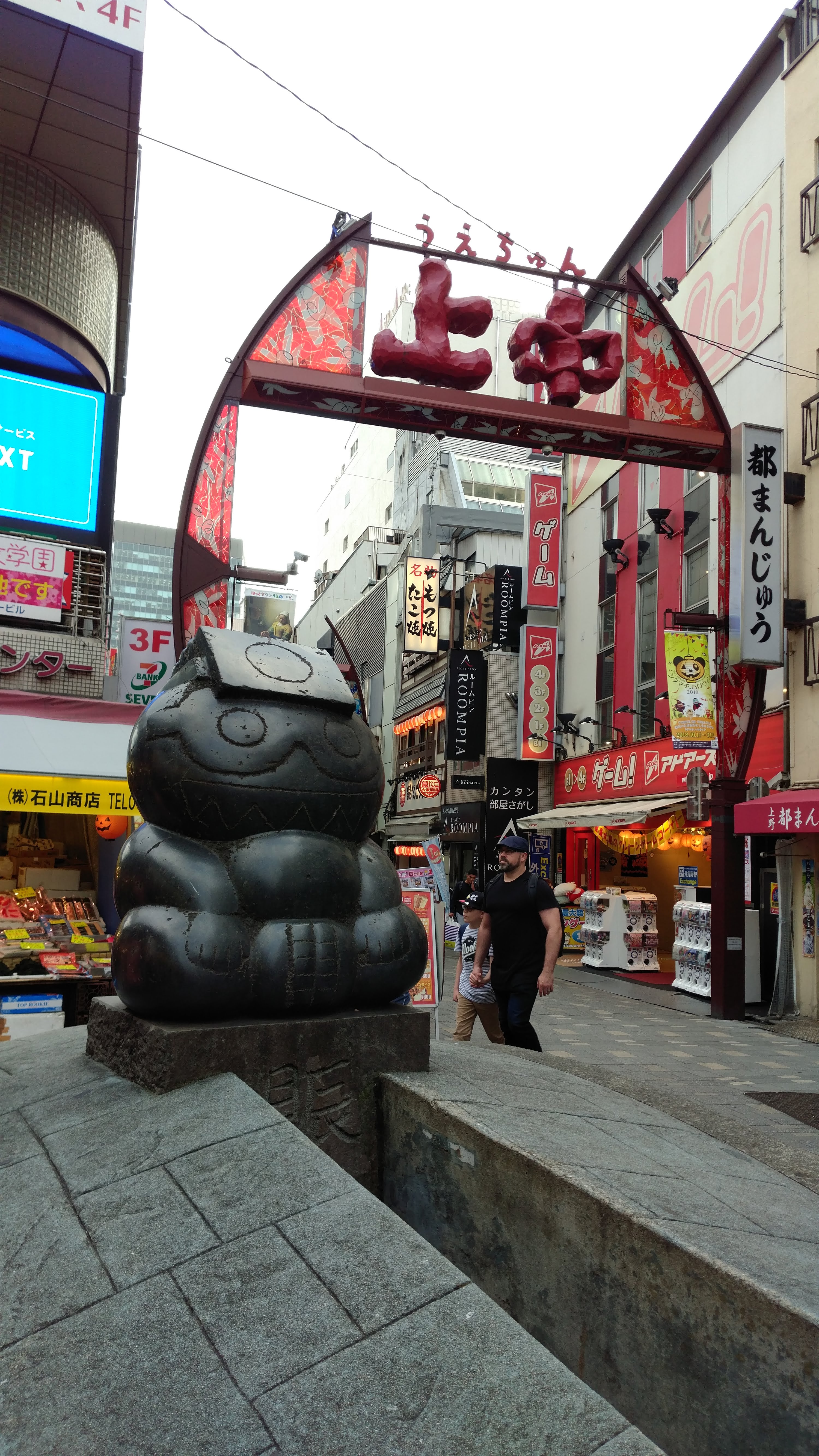 a statue at one of the market entrances