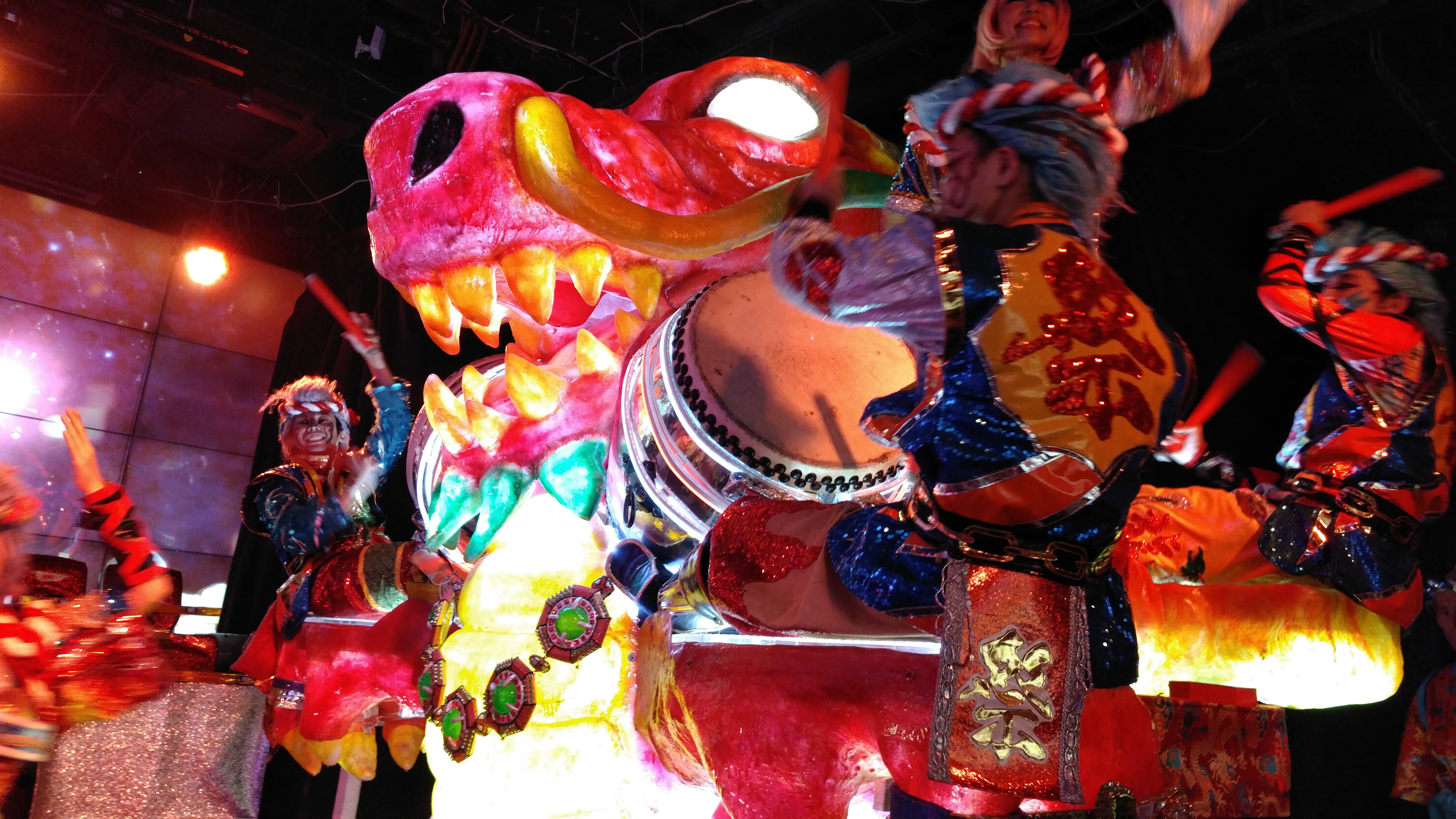 robot dinosaur with taiko drummers