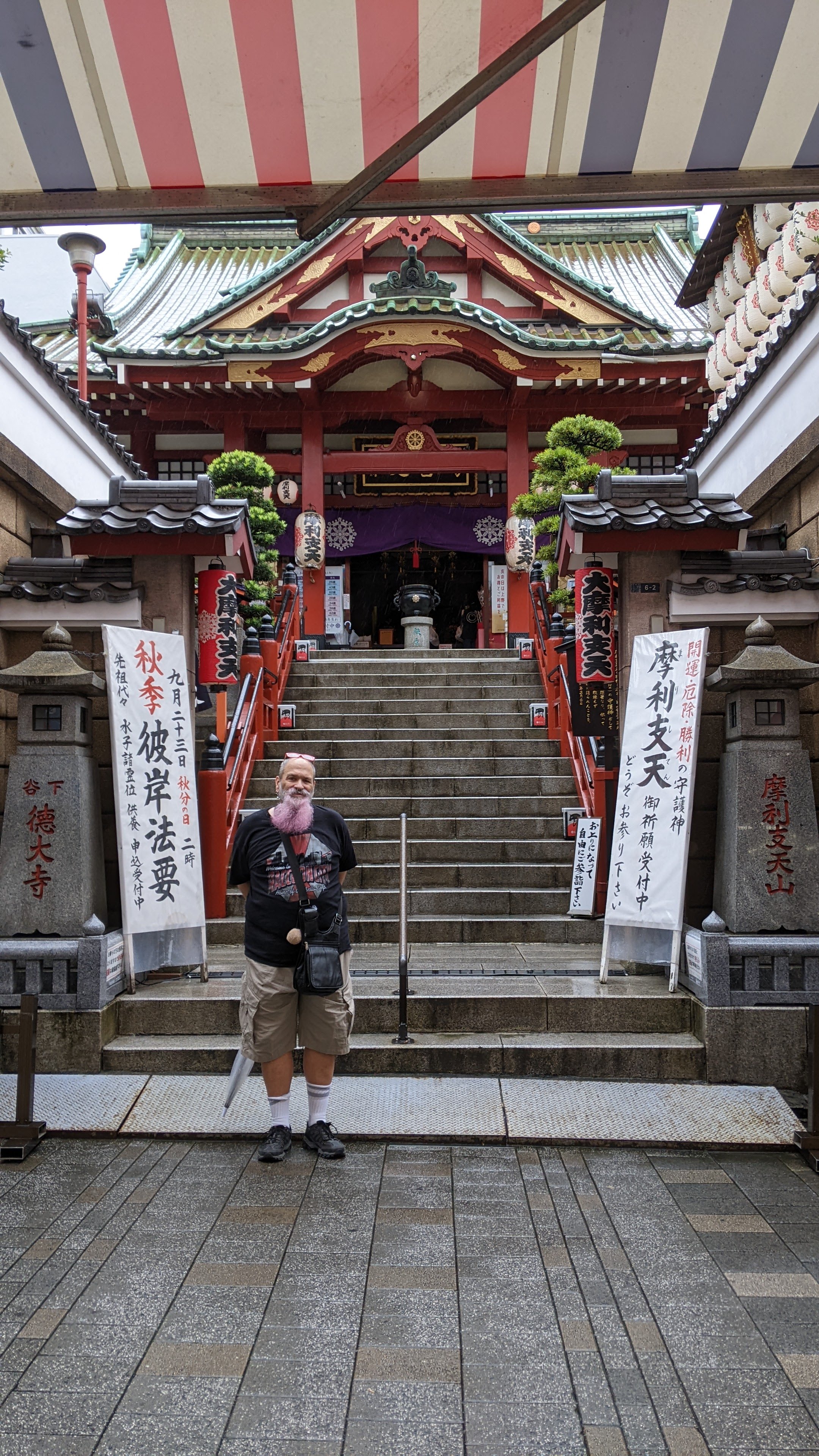 Chris outside the shrine in the market