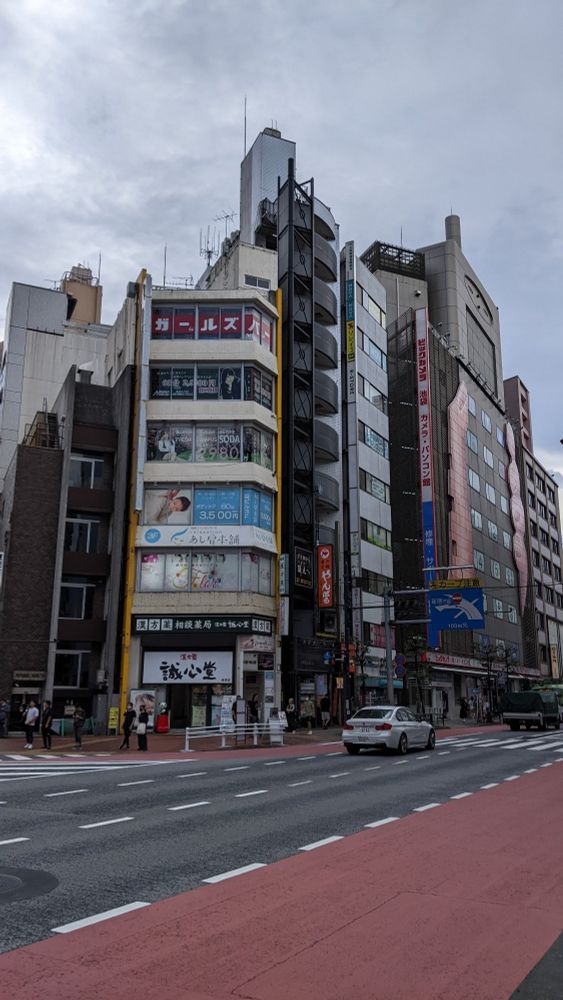 A building with windows covered in ads