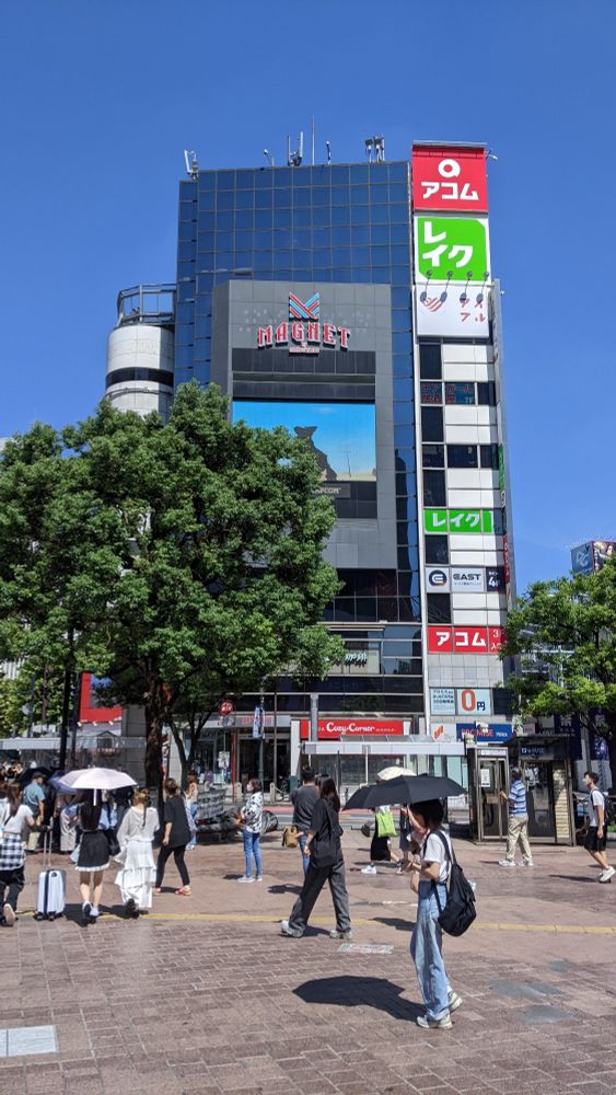 a tall, slender building with a screen