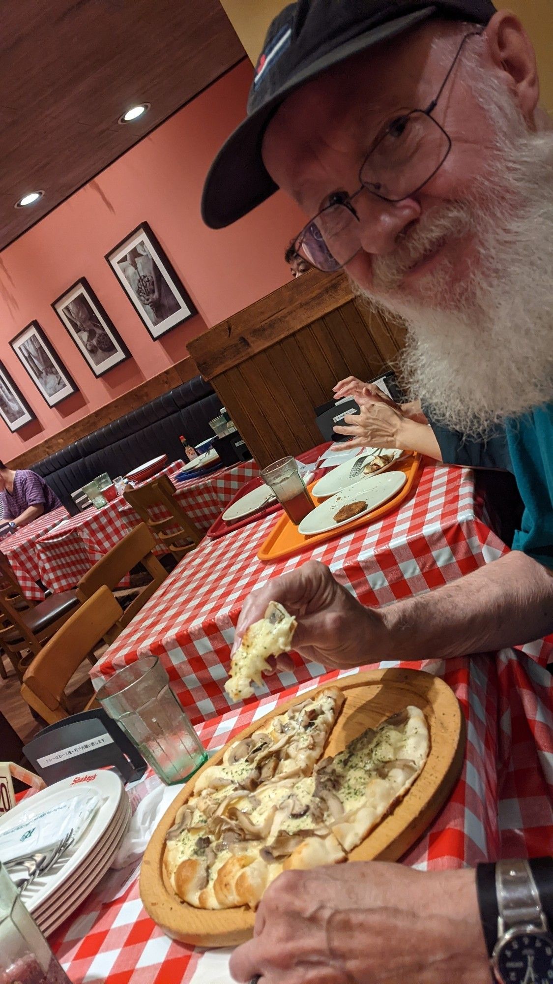 Chris and a mushroom pizza